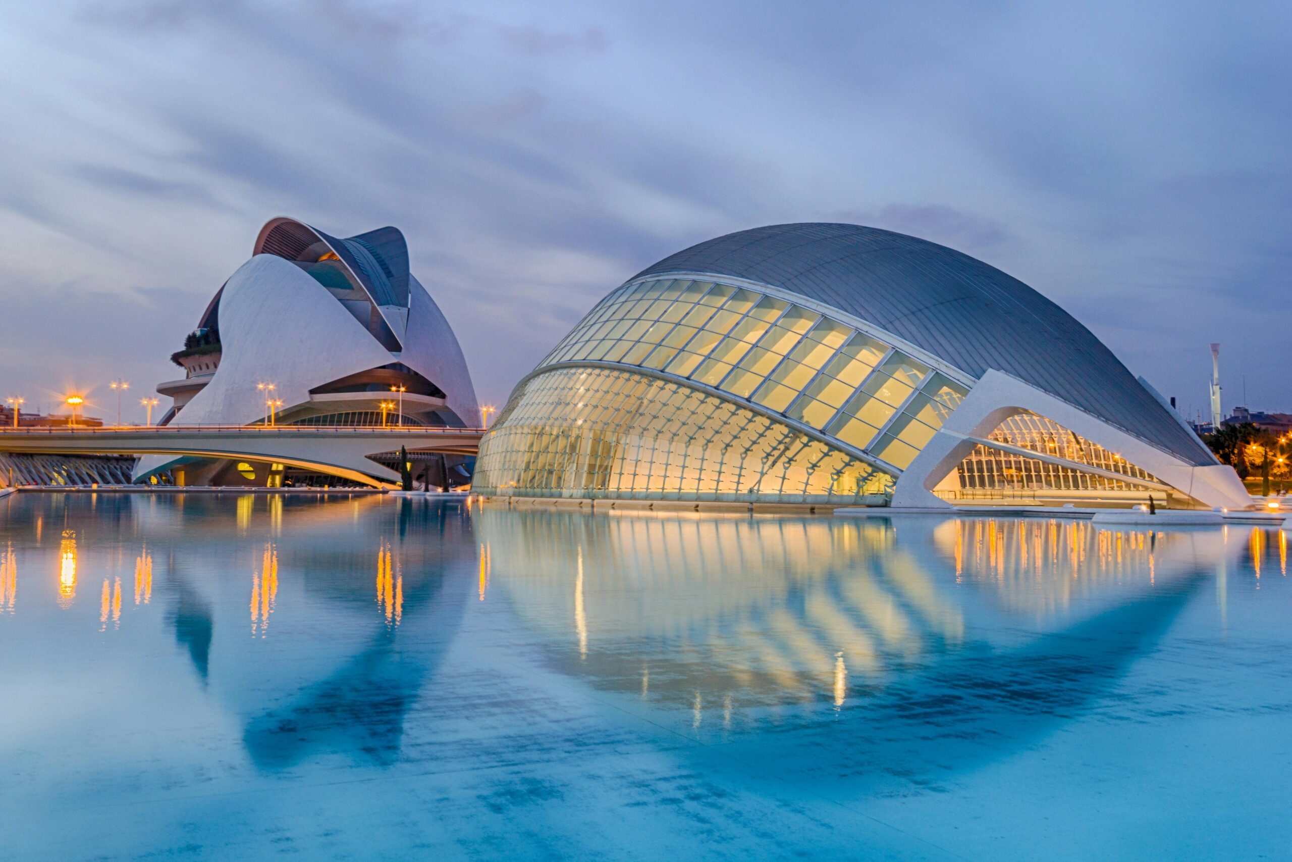 Home A breathtaking view of Valencia's City of Arts and Sciences reflected in serene waters at twilight.